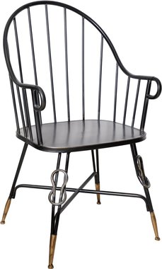 Кресло из металла с закругленной спинкой